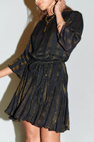Thumbnail for Model wearing Black And Gold Riri Dress