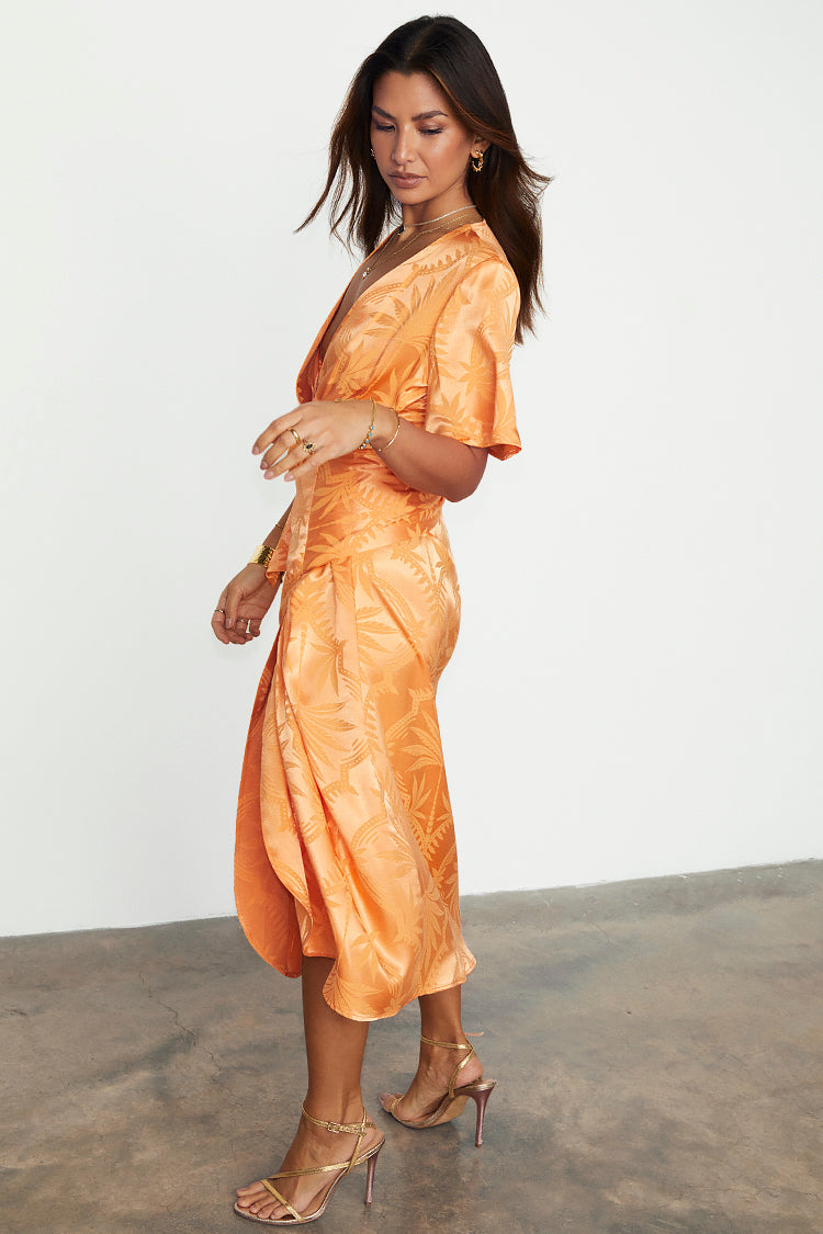caption_Model wears Apricot Palm Vienna Dress in UK size 10/ US 6