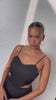 Model wearing Black Love Story Mini Dress standing facing the camera 