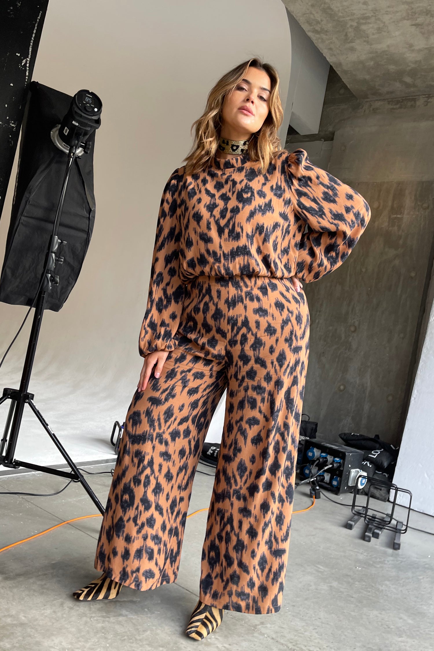 Model wearing Animal Jumpsuit standing facing the camera
