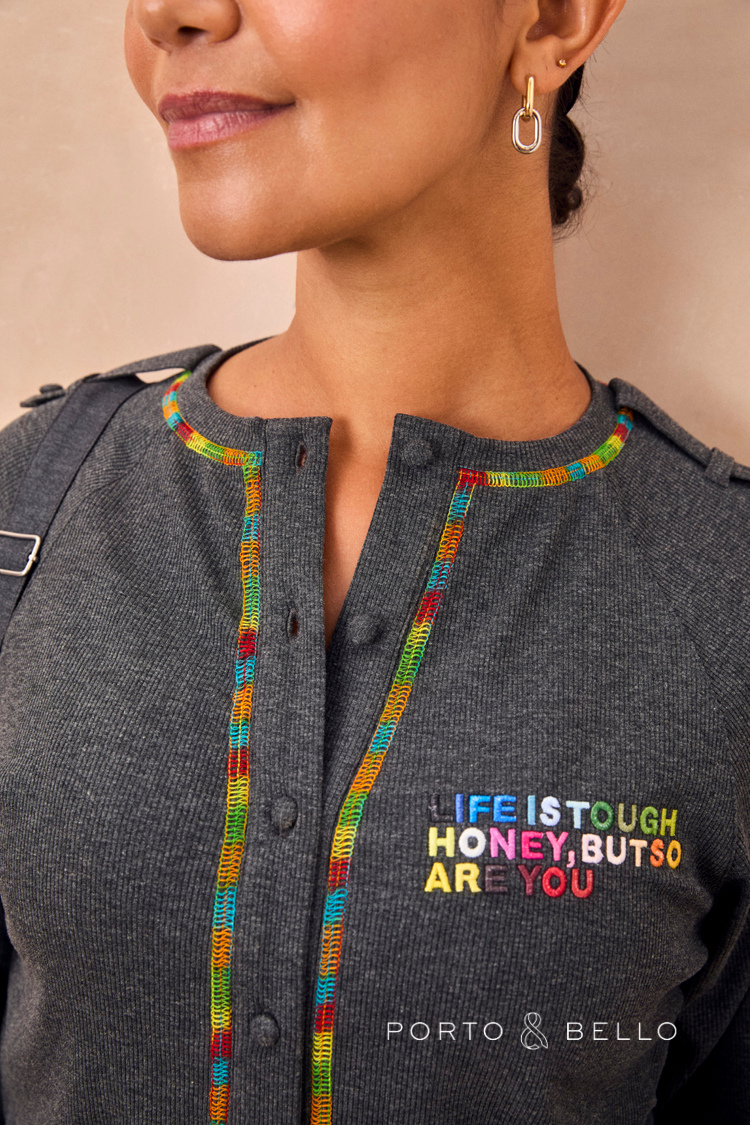 Charcoal ribbed T-shirt featuring rainbow-stitched button placket and Life Is Tough Honey multicoloured embroidery.