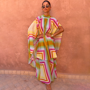 Bright Geo Stevie Maxi Dress with cape sleeves and a colourful geometric print, ideal for vacation evenings.