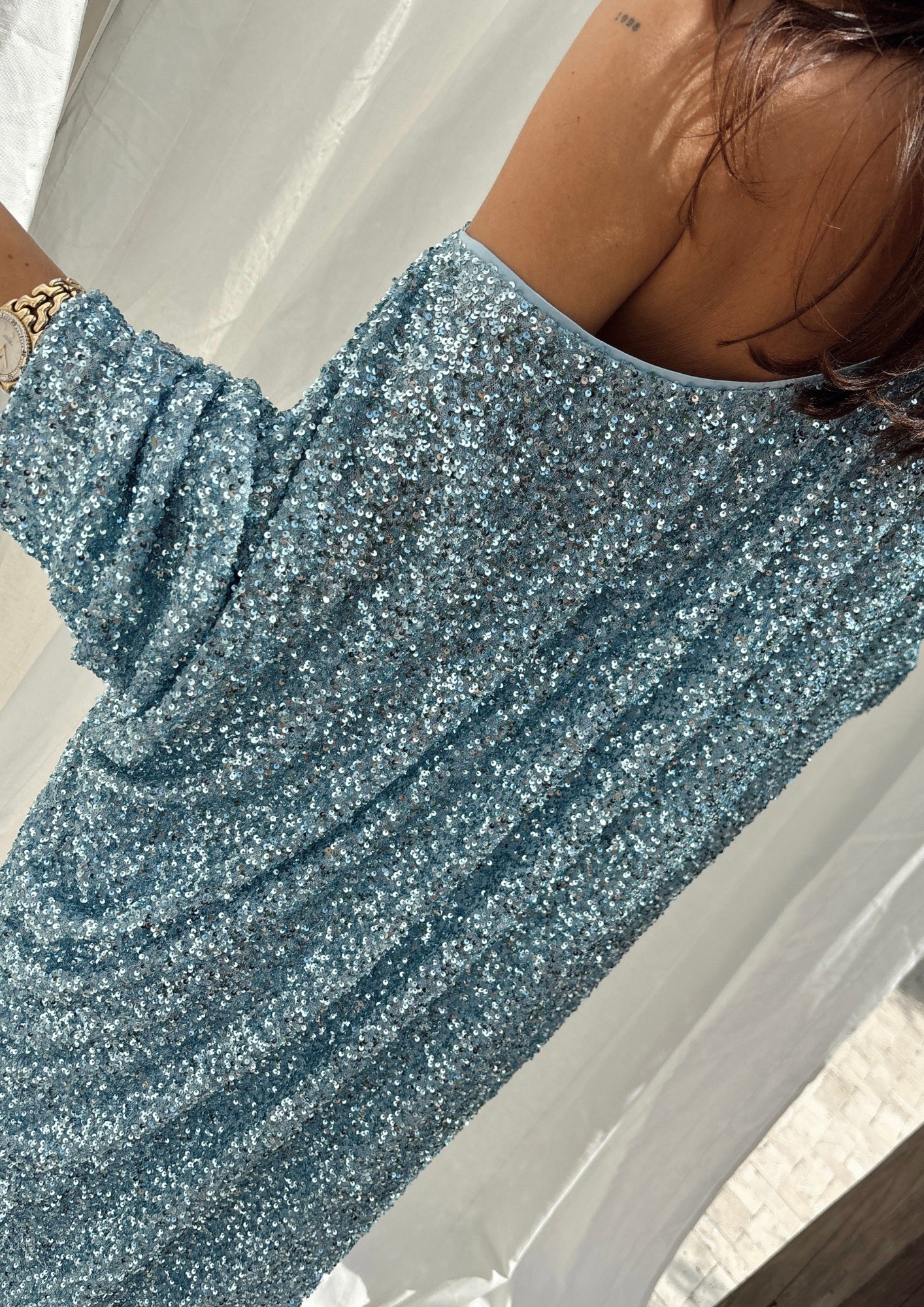 caption_Model wears Ice Blue Sequin Jem Dress in UK size 10/ US 6