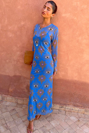 Blue Eye Mesh Dress with eye and heart motifs, long sleeves and a fitted maxi silhouette, styled on a model.