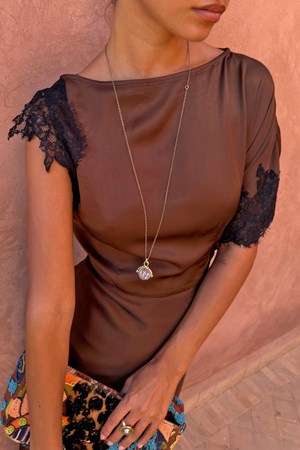 Chocolate and Black Lace Fearne Dress with cap sleeves and a round neckline, styled with a gold pendant.