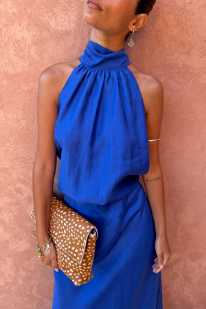 Cobalt Billie Top featuring a high halterneck and front gathers, styled as a co-ord on a model.