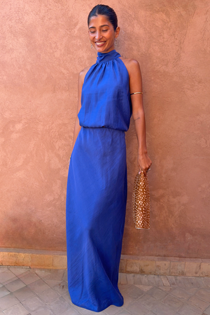 Cobalt Daphne Skirt in vibrant blue, paired with a matching halter neck top and leopard print clutch bag.