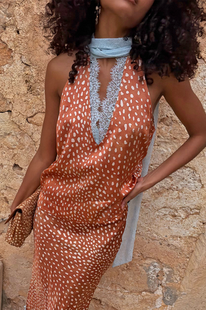Multi-wear Fawn Lily Top in brown fawn print featuring light blue lace neck ties and a deep V-neckline.