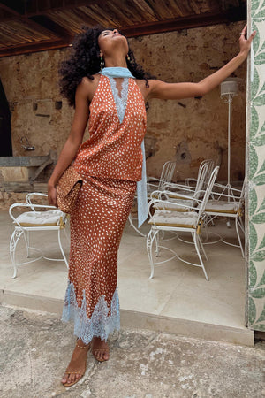 Fawn print Midi Maeva Skirt with light blue lace trim, styled as a matching co-ord on an outdoor terrace.