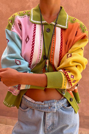 Geometric Palm Cardigan in green with colourful jacquard motifs and blanket stitch detailing.