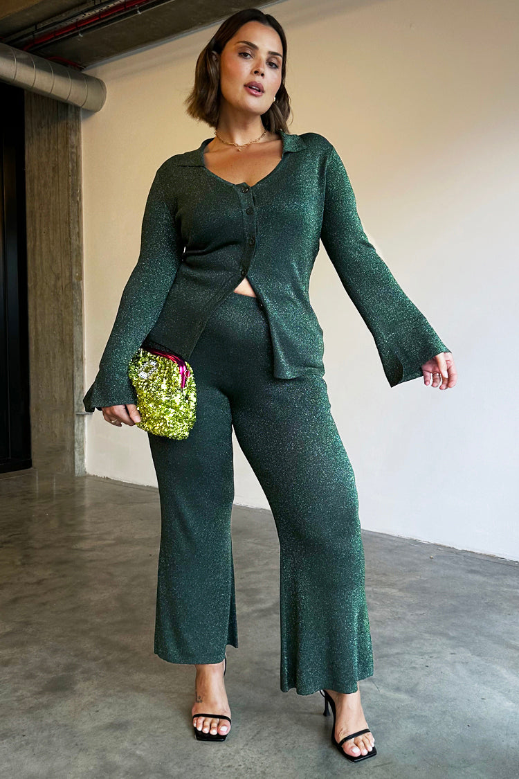 caption_Model wears Emerald Sparkle Trousers in XL