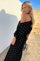 Thumbnail for model looking over her shoulder wearing the Black Tilly Plisse Dress with Gold Fleck