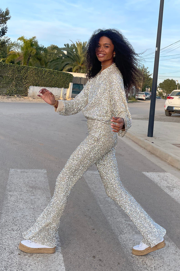 Model wearing Sequin Flared Trousers 