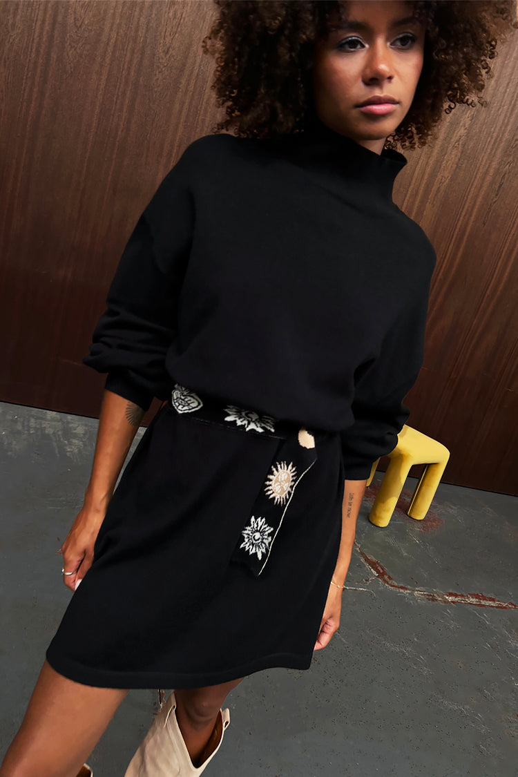 Model wearing Black Lyon Belted Knit Dress 