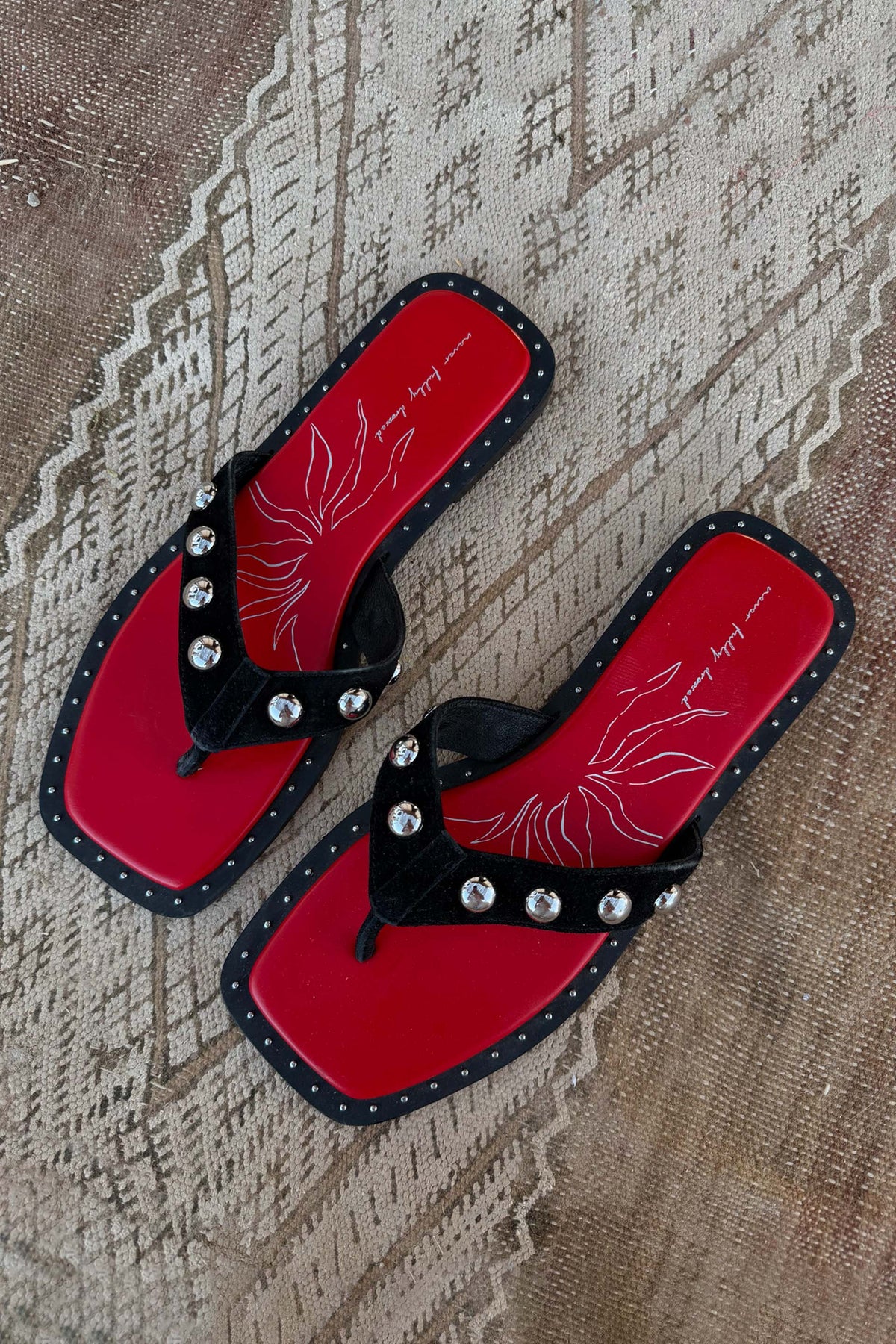 Black Leather Stud Sandals with a red footbed and square toe, featuring silver studs on suede straps.