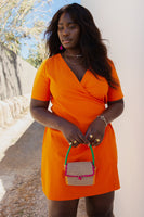 Thumbnail for  Model wearing Orange Cotton Linen Mini Wrap Dress facing the camera