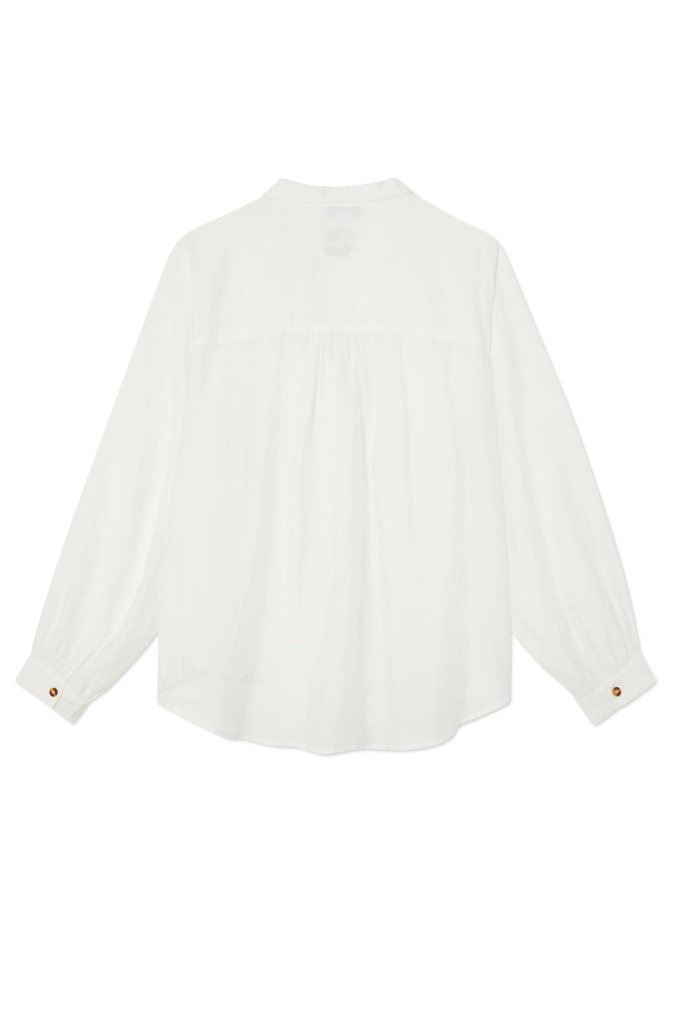 Oversized White Miley Shirt seen from the back, featuring blouson sleeves and contrast tortoise button cuffs.
