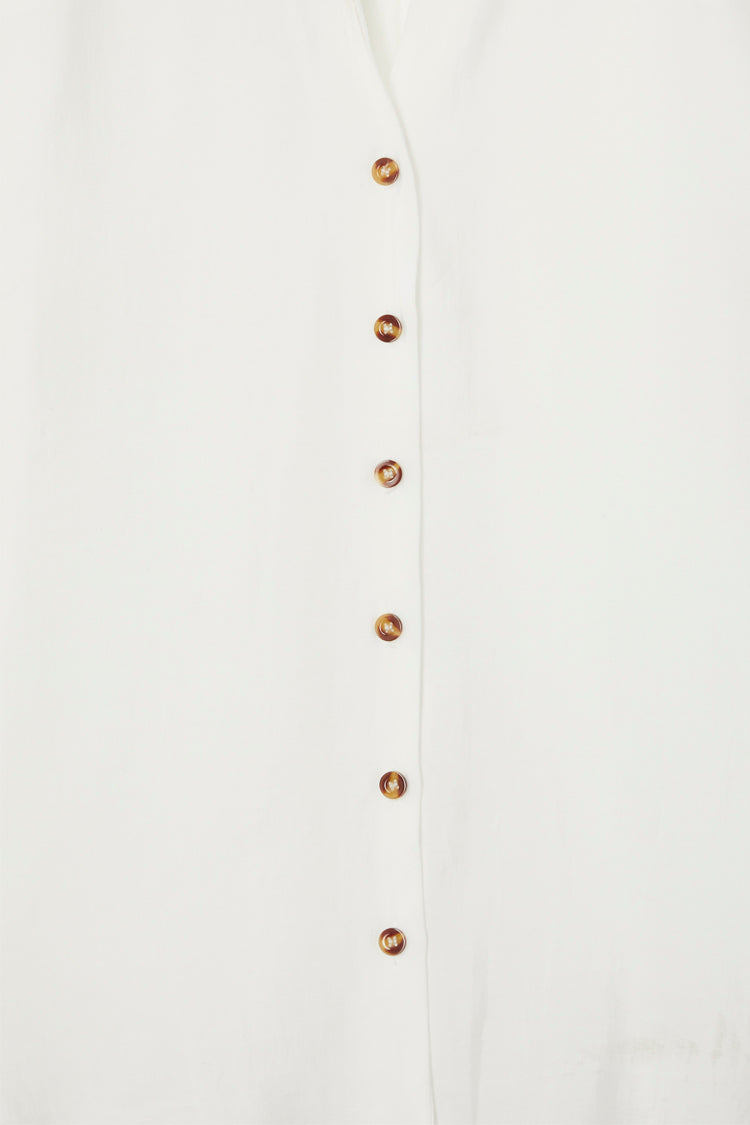 White Miley Shirt featuring contrast tortoise buttons on lightweight, slightly sheer fabric.
