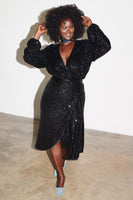 Thumbnail for caption_Model wears Black Sequin Vienna Wrap Dress in UK 18 / US 14
