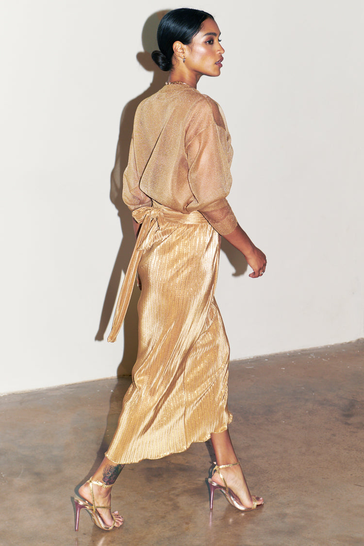 Model wearing Gold Plisse Jaspre Skirt