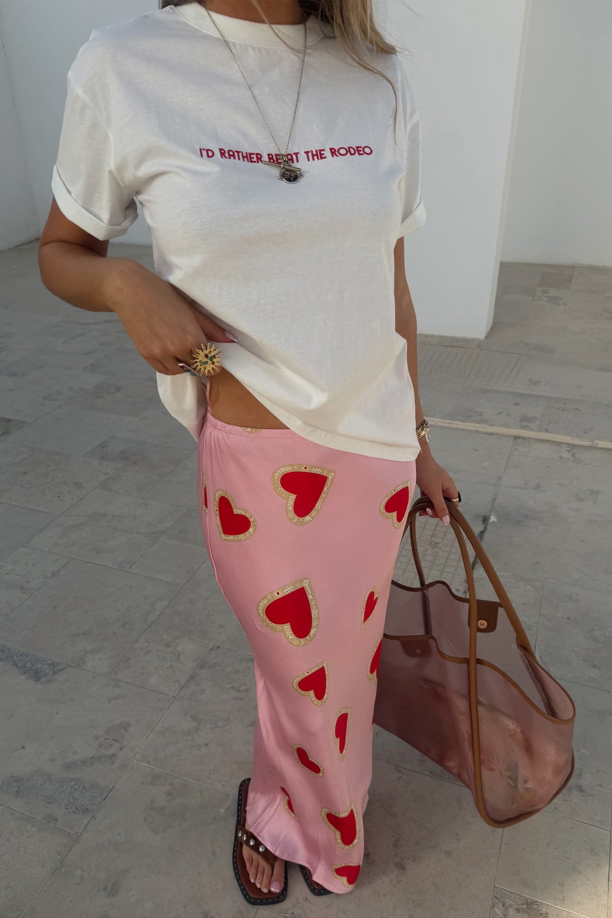 Pink Hearts Dorris midaxi skirt with red heart print and signature key motifs, styled with a white graphic t-shirt.