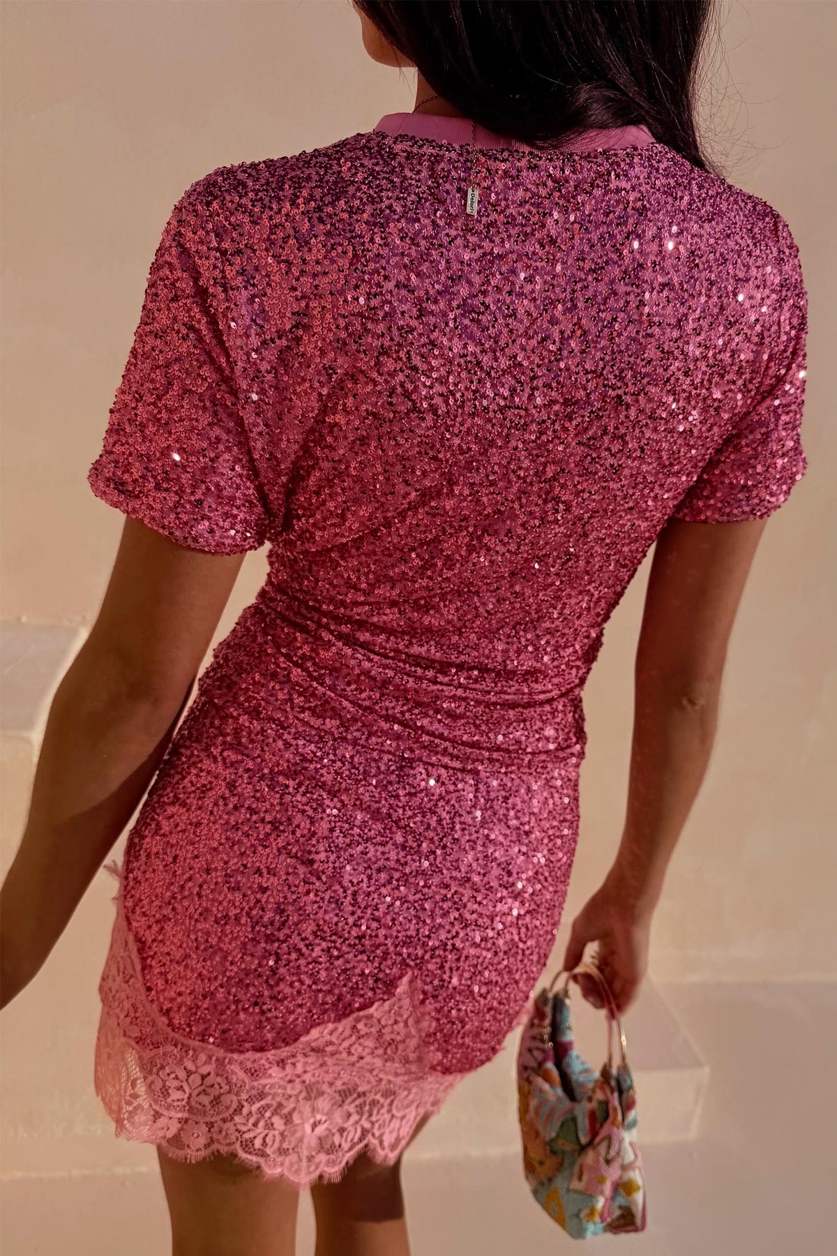 Pink Sequin T-Shirt with a relaxed fit and short sleeves, shown from the back with a ribbed neckline.