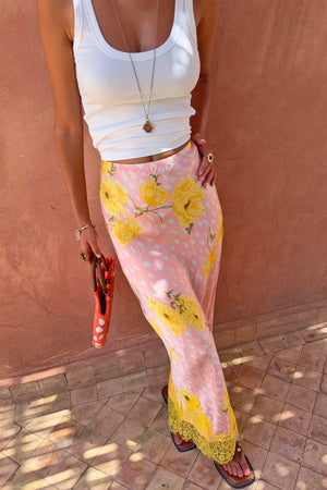 Pink Fawn Poppy Maeva Midi Skirt featuring a yellow floral and deer print with a contrast yellow lace trim.
