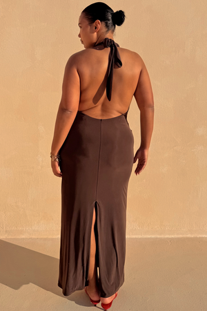 Chocolate Sabine Dress featuring an open back, halter neck tie and split hem, highlighting inclusive sizing.