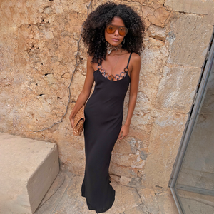 Black Sapna Petite maxi dress featuring connected ring detailing at the neckline and thin adjustable straps.