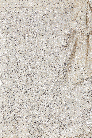 Close-up of silver sequins on the iconic Mini Jaspre wrap skirt.