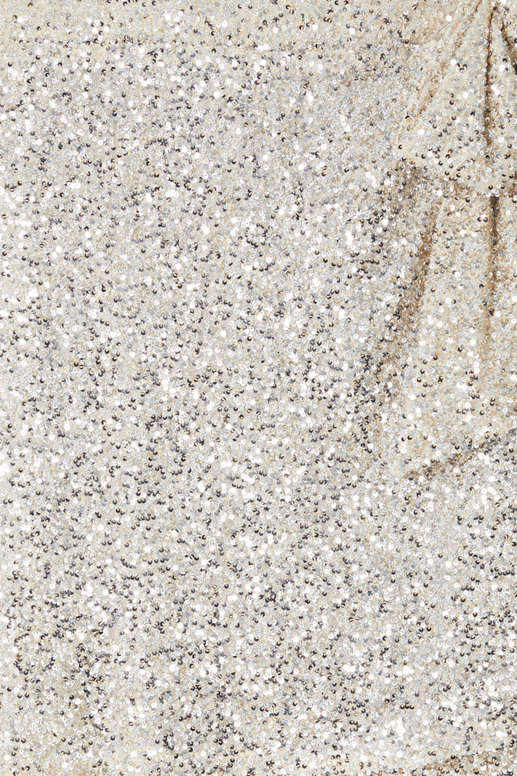 Close-up of silver sequins on the iconic Mini Jaspre wrap skirt.