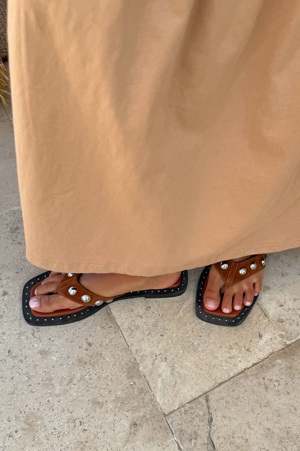 Tan Leather Stud Sandals with a square toe and silver stud detailing, worn with a coordinating tan dress.