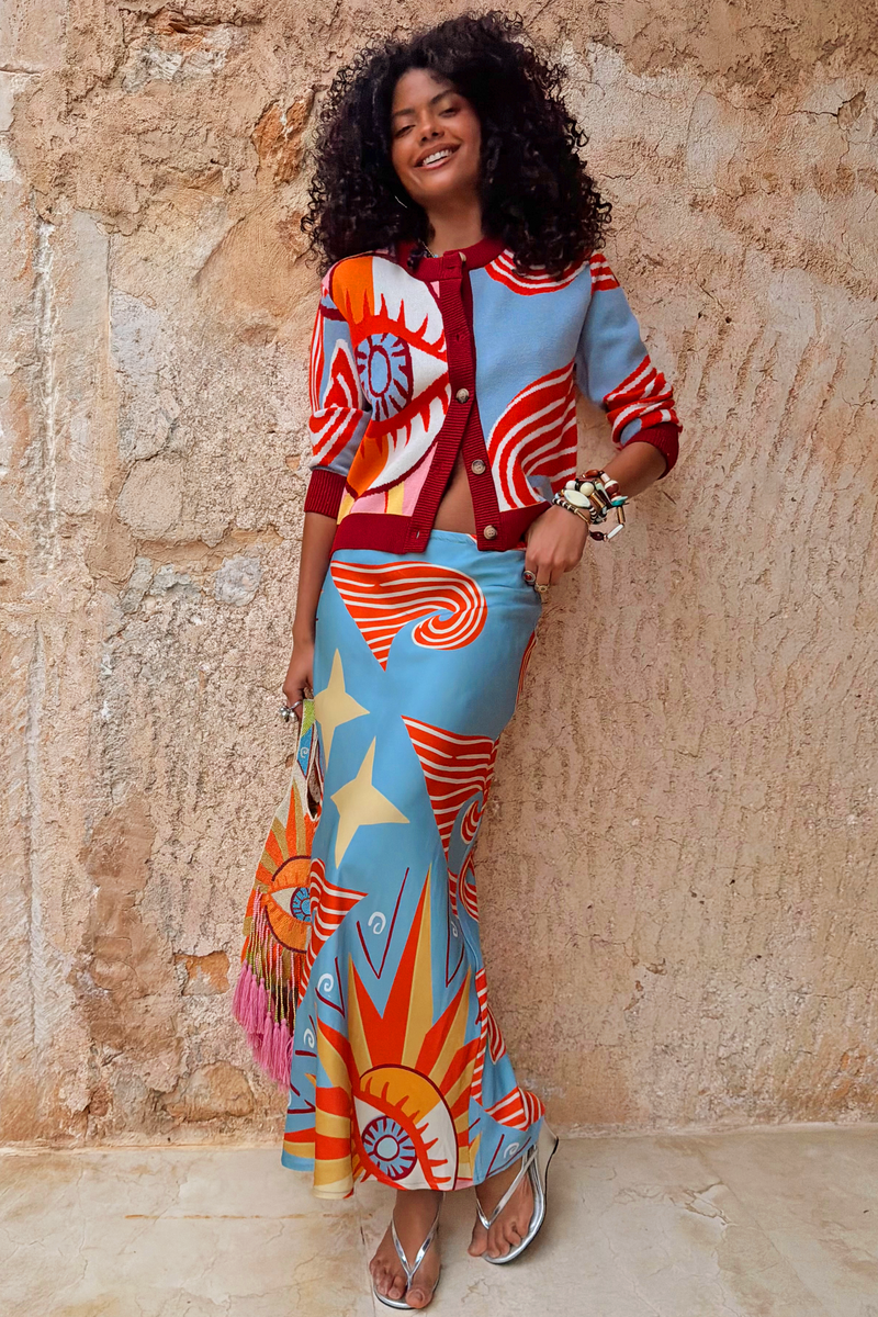 Petite Dolce Vita Dorris Skirt in a blue satin-feel bias cut with sun motifs and a matching Hollie cardigan.