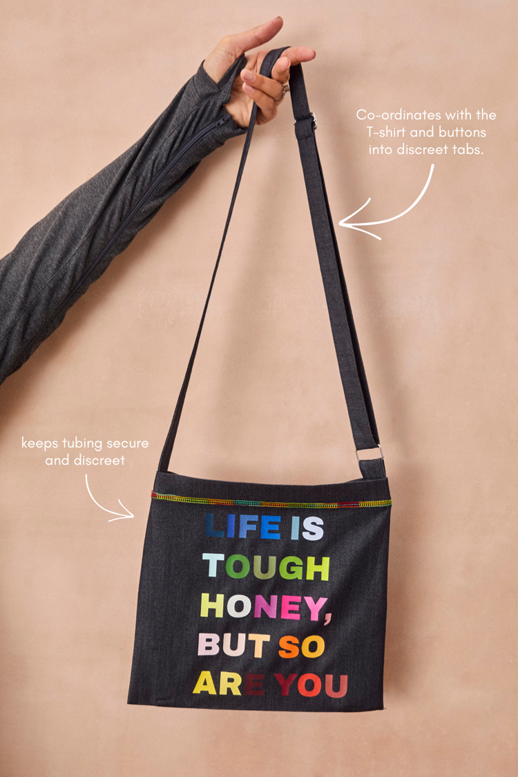 Charcoal Life is Tough Honey Drainage Bag featuring multicoloured text, rainbow stitching and an adjustable strap.