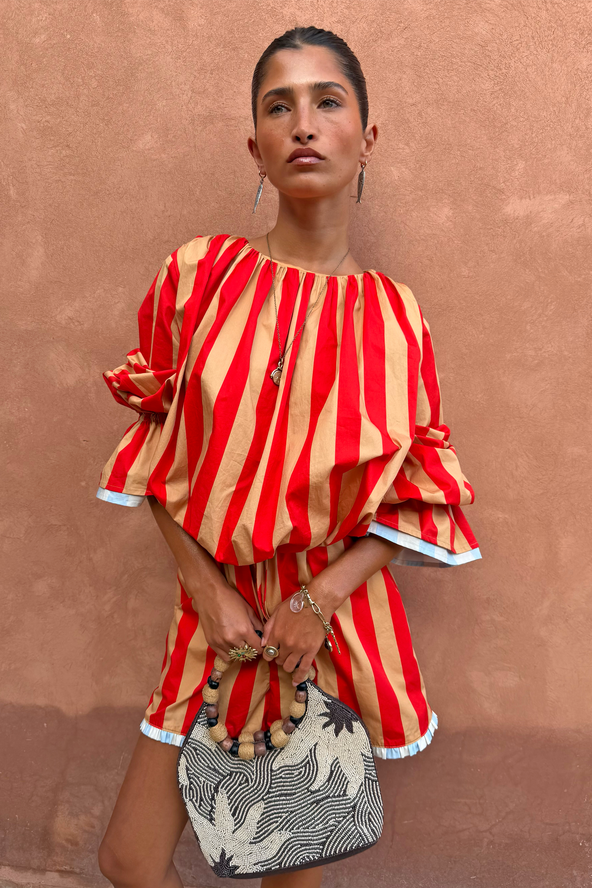 Red and camel Tomato Stripe Blouse with voluminous flared sleeves and matching shorts co-ord.