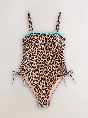 Leopard bandeau swimsuit with blue whipstitch embroidery and ruched side ties, shown in a flat lay.