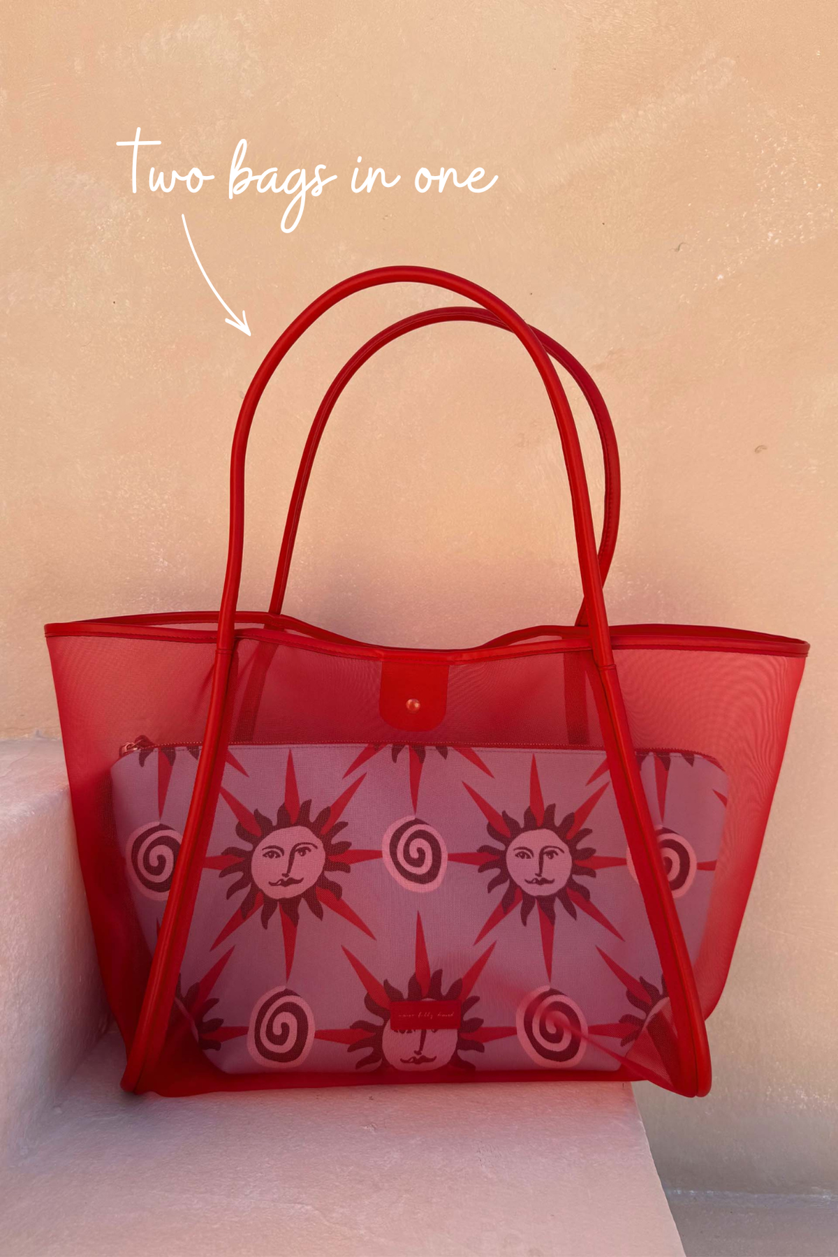 Red Mesh Tote Bag with leather straps and a detachable sun face print pouch, highlighting the two-in-one design.