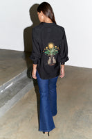 Thumbnail for caption_Model wears Black Running Wilder Miley Shirt in UK size 10/ US 6