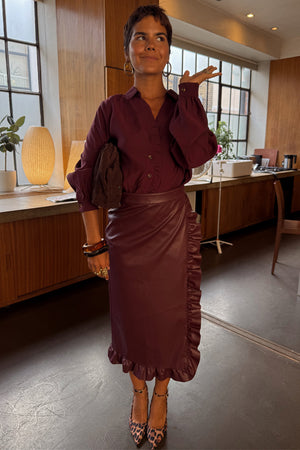 Multi-wear Burgundy Vegan Leather Ruffle Jaspre Skirt and matching wine shirt with leopard print heels.