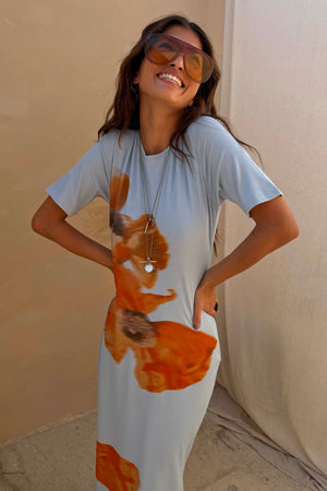 Ice Blue Floral Rib Dress featuring a large orange floral print on soft stretch ribbed fabric.