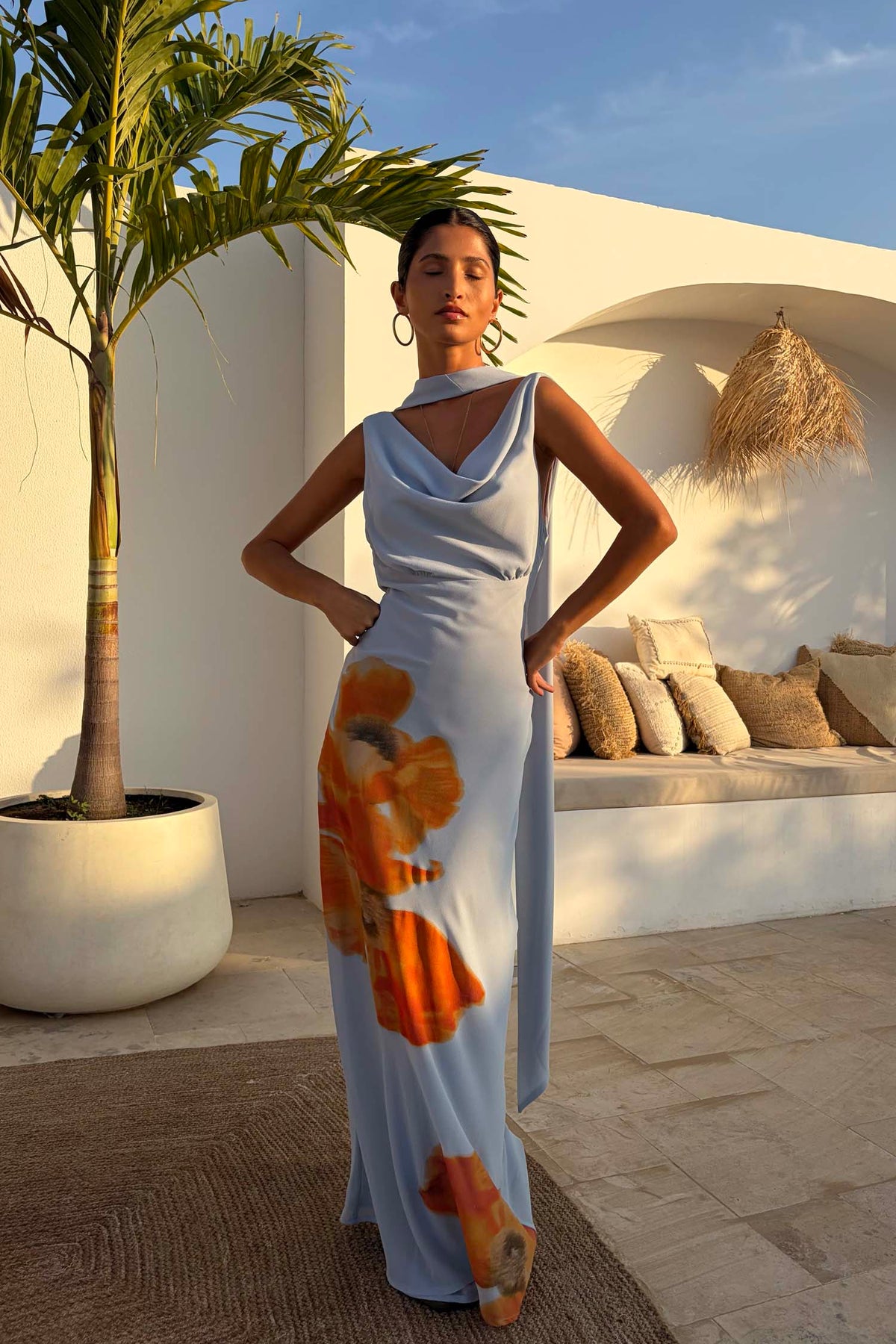 Ice Blue Floral Sophie Dress with a draped neckline, orange floral print and trailing multi-wear scarf detail.