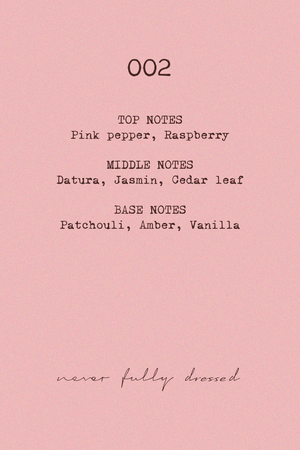 NFD Eau De Parfum 002 fragrance notes graphic on a pink background, listing pink pepper, raspberry, jasmine and vanilla.