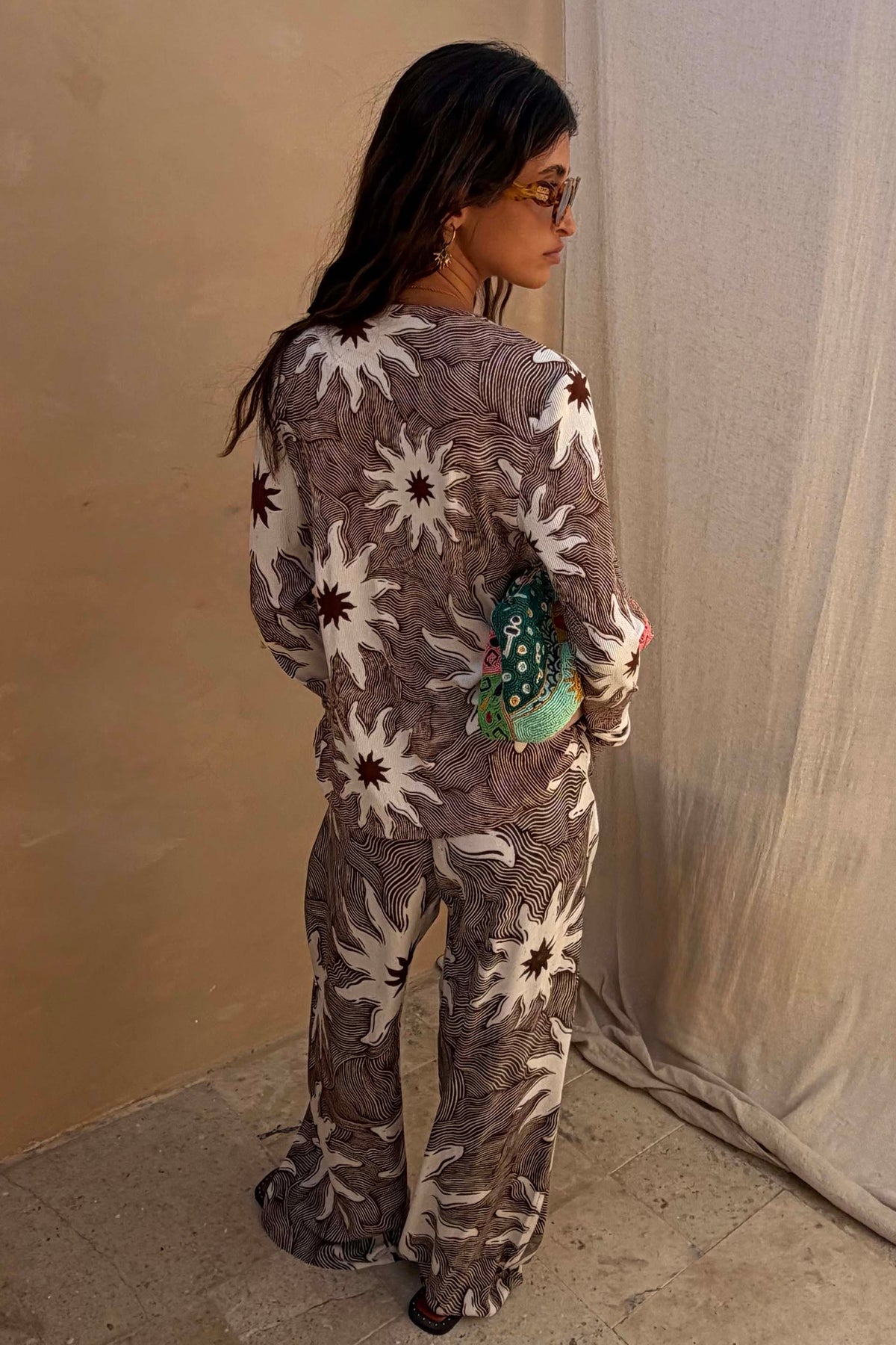 Chocolate Soleil Ellie Trousers and matching top featuring white sun motifs in a wide-leg co-ord.