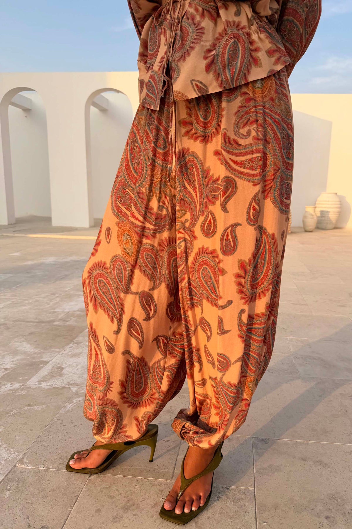 Peach Paisley Balloon Trousers with a breathable balloon silhouette, styled as a summer co-ord with matching top.