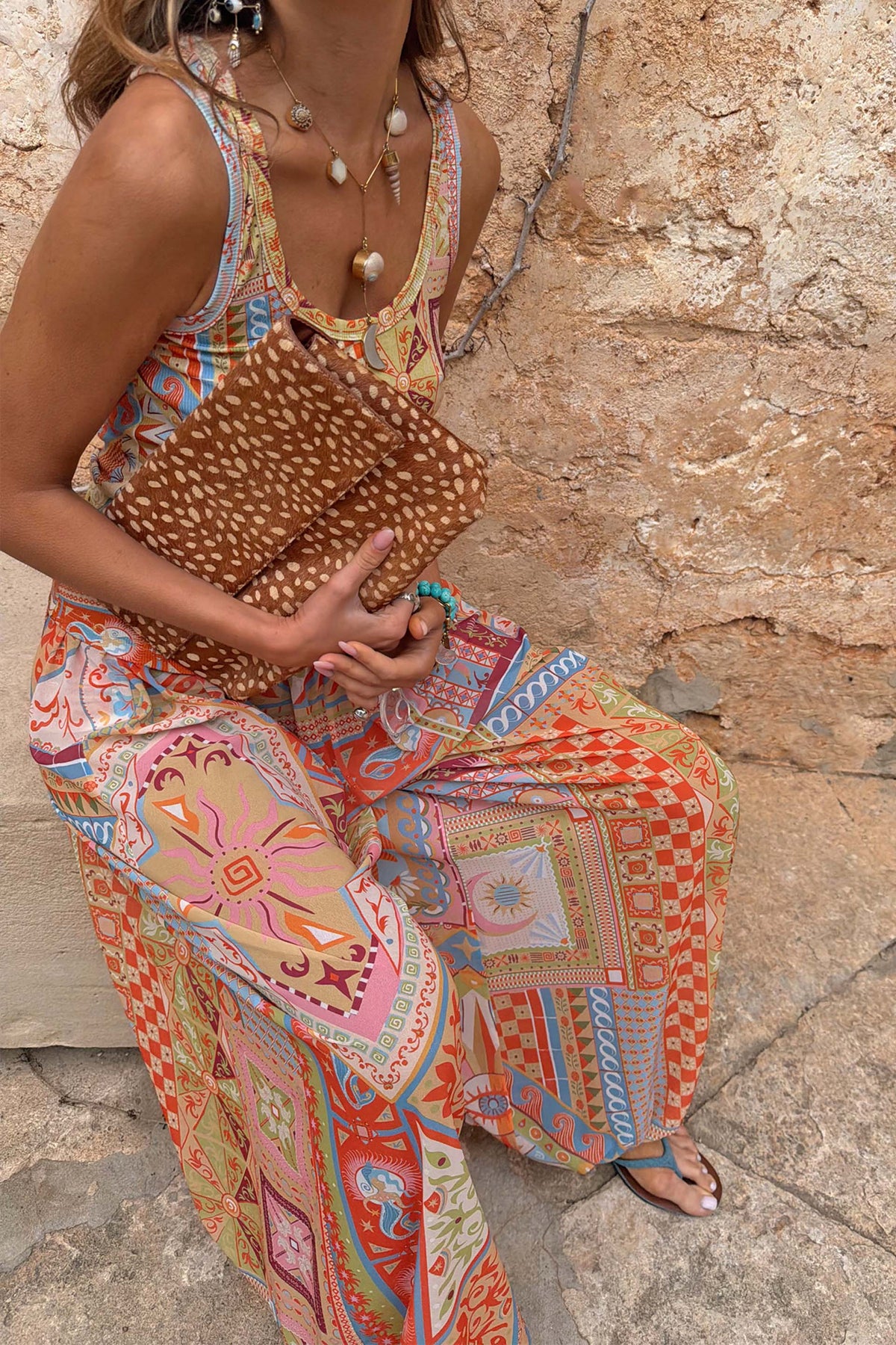 Dolce Vita Balloon Trousers featuring multi-coloured tile panels and sun motifs in a voluminous wide-leg fit.