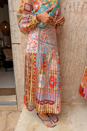 Pleated Dolce Vita Freya Skirt in a colourful tile patchwork print with an asymmetric yoke, designed in London.