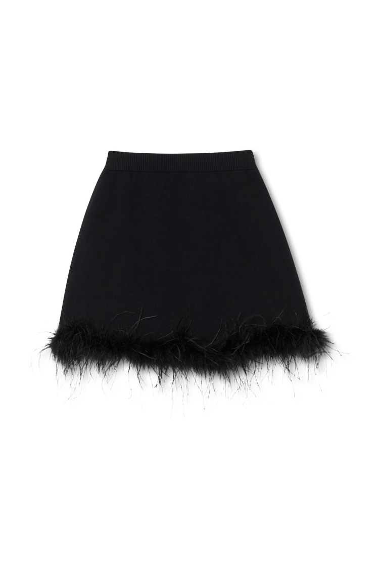 Black Jake Skirt with a detachable feather trim, featuring a weighty knit fabric and an elasticated waistband.