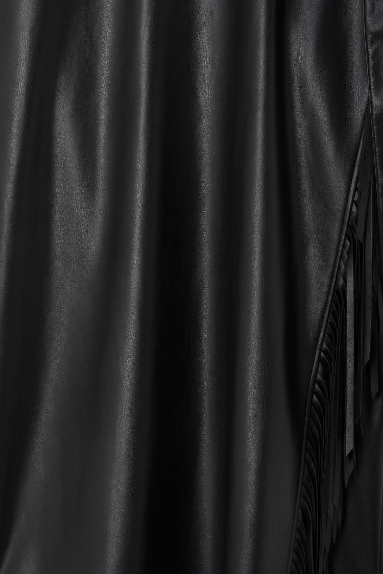 Black vegan leather and fringe detailing on the iconic Mini Jaspre Skirt.