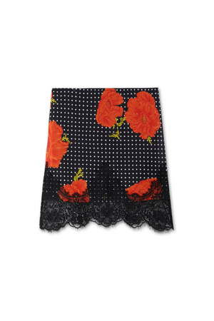 Black Poppy Mini Maeva Skirt with red poppy floral print, white polka dots and a black lace border.