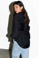 Thumbnail for Back of model wearing Black Sequin Crop Top over black shirt